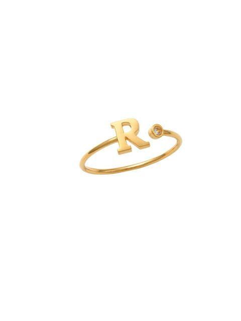 14K Gold Letter R Ring This trendy ring is an amazing statement. Lightweight durable and a sparkle to catch anyones eyes.   Each detail of the letter is carefully perfected and formed for easy reading. Simple and charming they can dress up every outfit with personalized style. Your everyday ring choose just got a whole lot easier. 